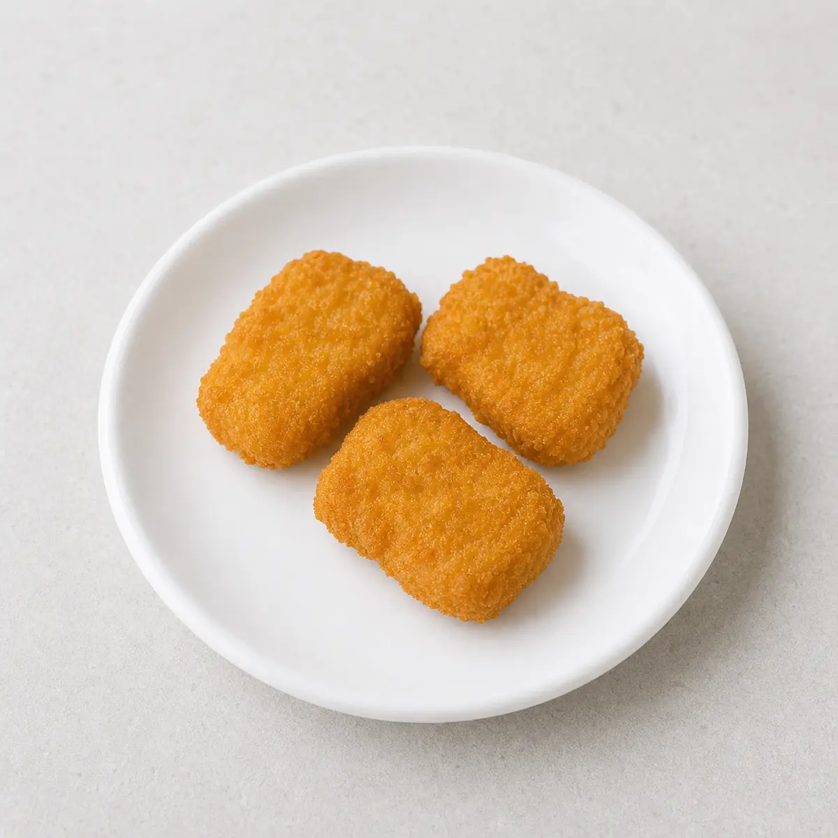 Breaded chicken nuggets on a plate