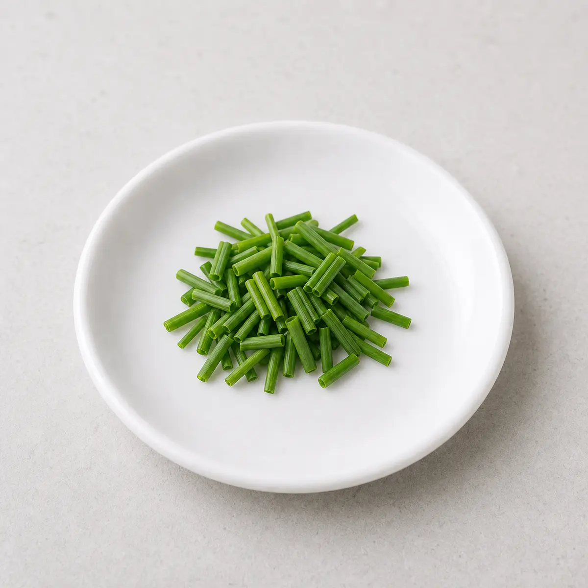 Chopped fresh chives on a saucer