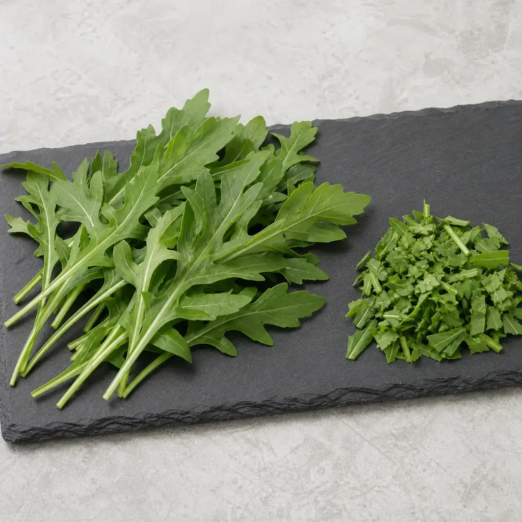 Plain arugula on a clean unbranded surface for a reptile food-safety check.
