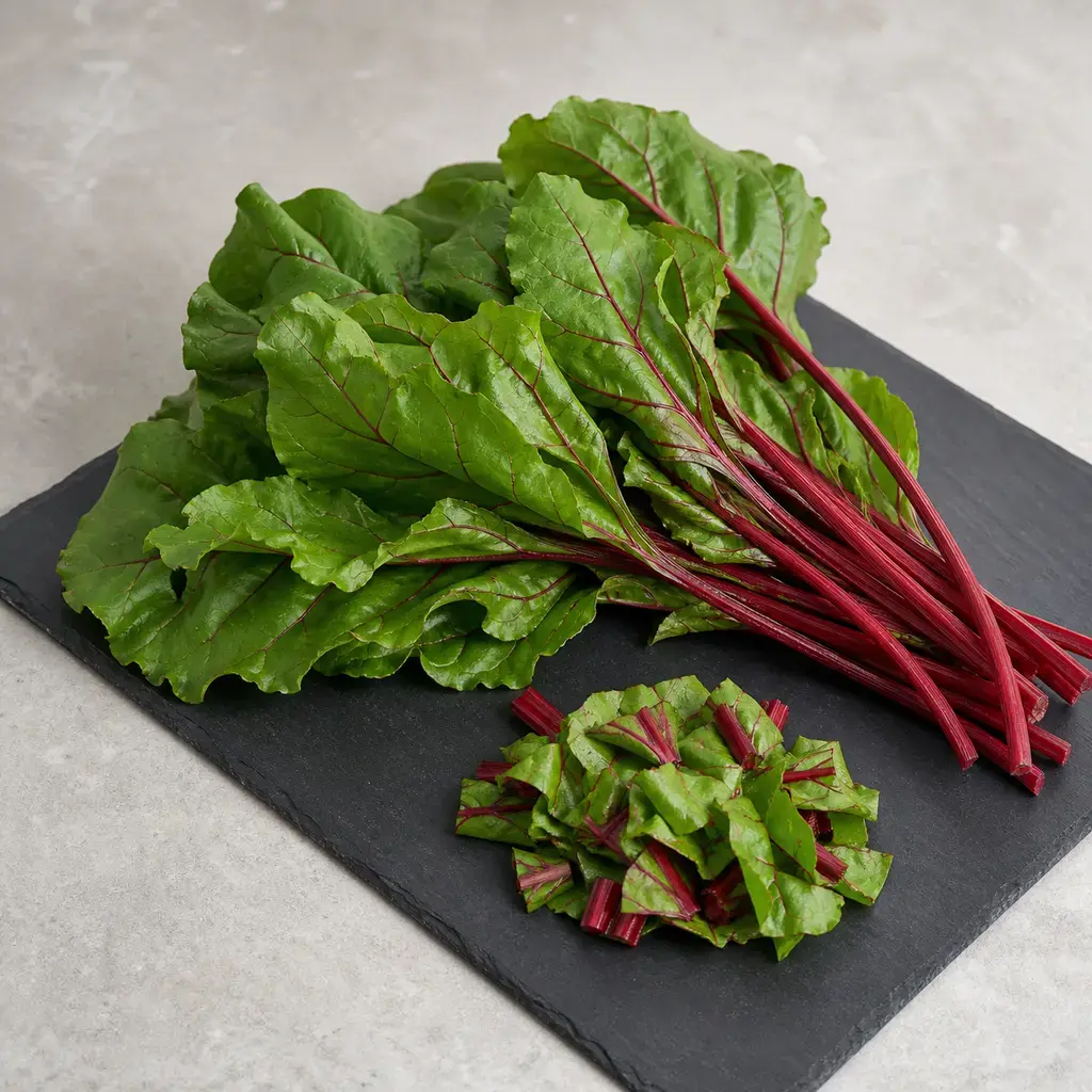 Plain beet greens on a clean unbranded surface for a reptile food-safety check.