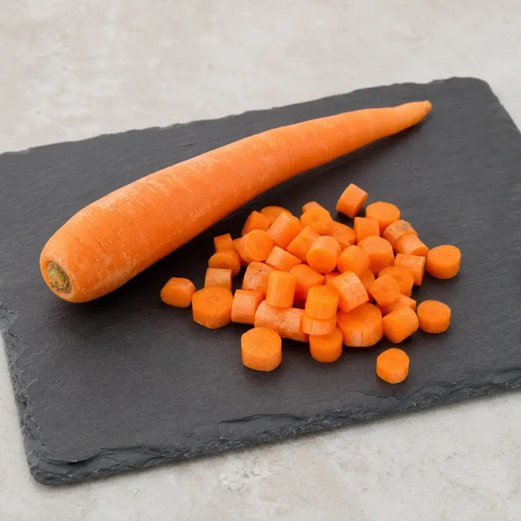 Plain carrot on a clean unbranded surface for a reptile food-safety check.