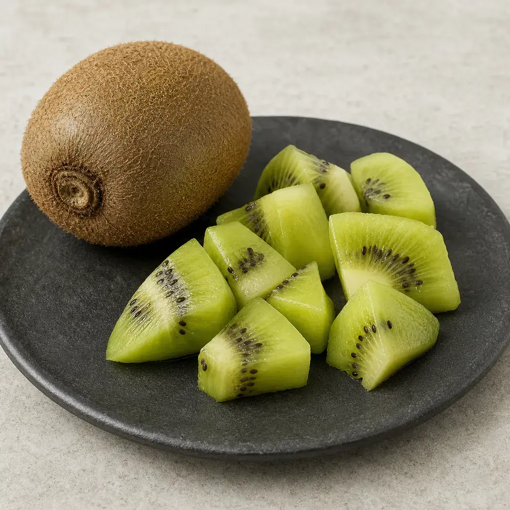Plain kiwi on a clean unbranded surface for a reptile food-safety check.