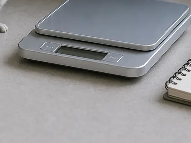 Digital gram scale for chinchilla weight checks.