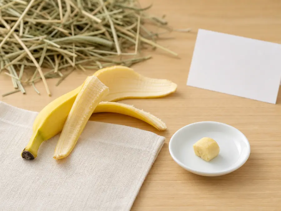 Banana peel set apart from a tiny banana piece for a small mammal food-safety check.